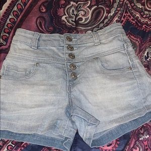 High rise light blue shorts with various buttons